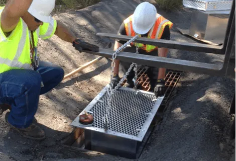 Lowering the StormWater Petro-Barrier Into the drain housing